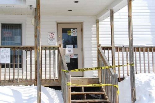 The entrance to the North Frontenac Township office, taped off after an oil leak inside the building.